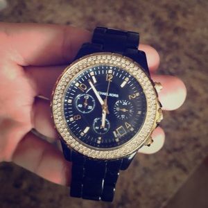 TWO Michael Kors watches.